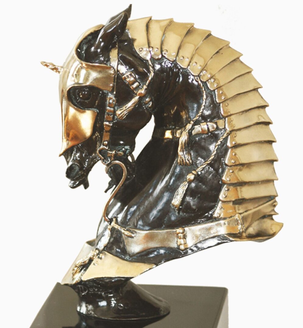 A statue of a horse with a golden helmet.