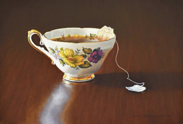 A painting of a tea cup with a tea bag.